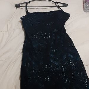A womens black teal dress